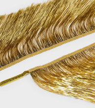 Guirnalda de fiesta con flecos de oropel iridiscente dorado